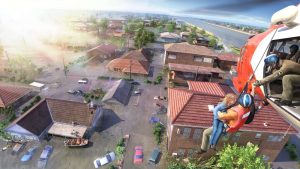 aerial of helicopter winching up two people from flooded suburb